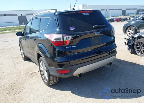 2017 Ford Escape Titanium z USA, uszkodzony, nr VIN 1FMCU0J96HUA64820